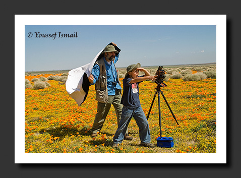 Camera Man and Lens Boy catching rogue light rays among the fleeting moments of time.