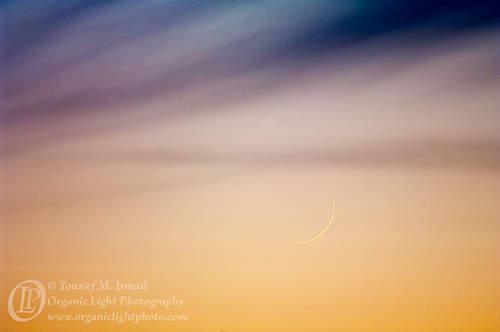 New crescent Moon and Dark Clouds